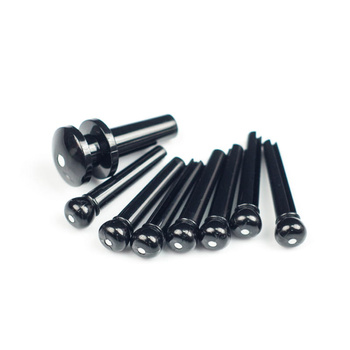 Kołki mostka czarne z białą kropką do gitary akustycznej + 1 zaczep paska D'Addario