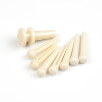 Kołki mostka kremowe do gitary akustycznej + 1 zaczep paska D'Addario